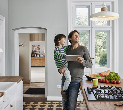 father-son-smart-home-automation-getty-951524988