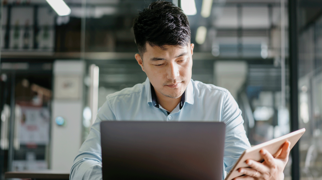 man with laptop and tablet