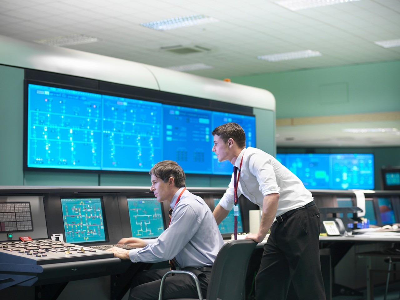 Workers in a control room power station